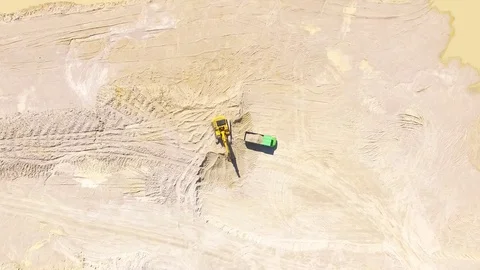 Aerial view of a working excavator in the mine or construction site	 Stock-Footage 71972909