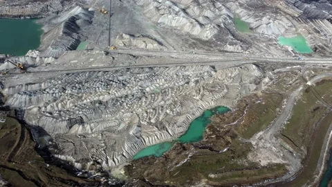 Aerial view of working open mine pit. Drone shot of coal mining activity Stock Footage 165325408