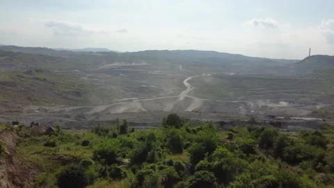 Aerial view of working open mine pit. Drone shot of coal mining activity Stock Footage 165325737