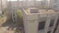 Aerial view wrecked abandoned building, no people, deserted city HD Footage
