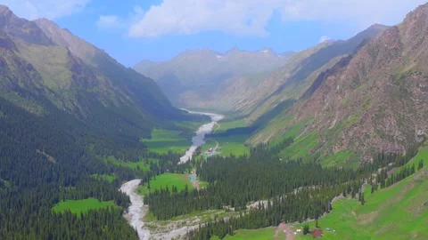 Aerial view of Xiata Valley, snow-capped peaks, alpine meadow and grazing Stock Footage 340856752