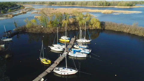 Aerial view Yachts stand at the dock in the yacht club. April 24 2020, Ukrainka Stock Footage 129972632
