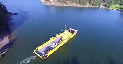 Aerial view of a yellow cable ferry, in barosund, Finland Stock Footage 64834562