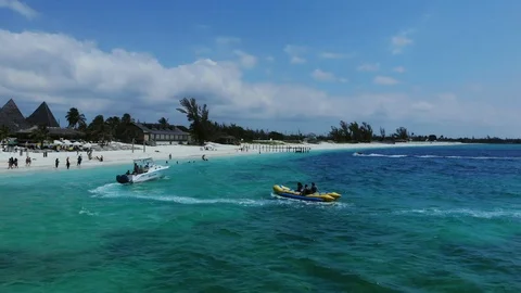 Aerial View of Yellow Flying Fish Towable Ride at Taino Beach, Bahamas Stock Footage 108729580