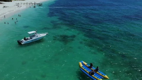 Aerial View of Yellow Flying Fish Towable Ride at Taino Beach, Bahamas Stock Footage 108729595