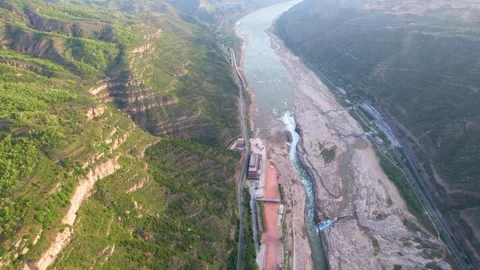 Aerial view of the Yellow River flowing through a deep canyon in China Stock Footage 342249170