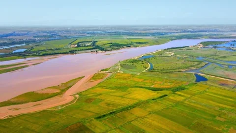 Aerial view of the Yellow River Plain in autumn with rivers and fields Stock Footage 295860882