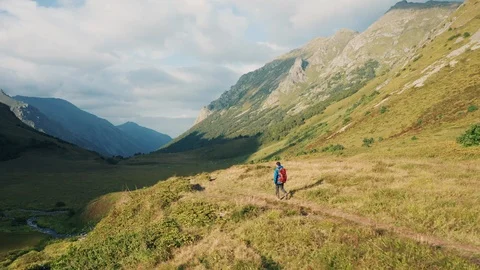 Aerial view: young guy walking on nature Stock Footage 118431122