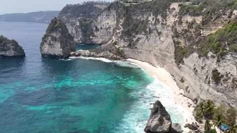 Aerial view of young lady on the cliff of Diamond Beach, Nusa Penida, Bali. Stock Footage 319924531