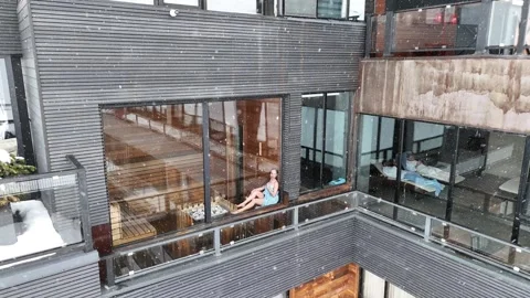 Aerial view of young lady in sauna on the roof. Gudauri, Georgia. Stock Footage 320209484