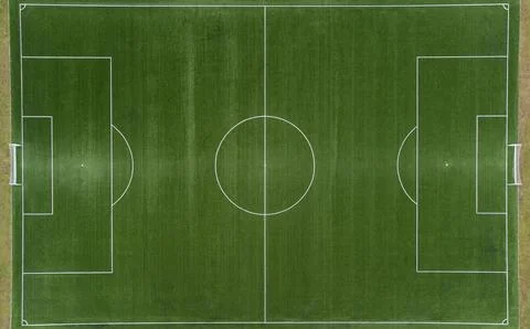 Aerial view from zenith/nadir angle down of a soccer field on a sunny day, wh Stock Photos