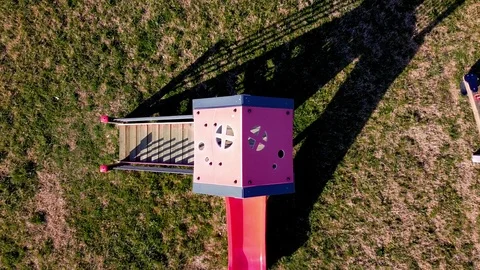 Aerial view, zoom out, of an empty playground. Stock Footage 124497300