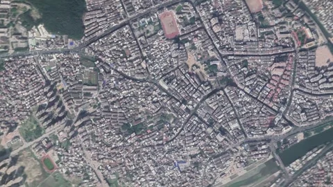 Aerial view zooming down onto dense urban landscape of small chinese city. Stock Footage 336326964