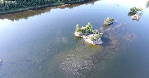 Aerial view.4K flying over the polluted river, with many logs at the bottom Stockbeeldmateriaal 73601655