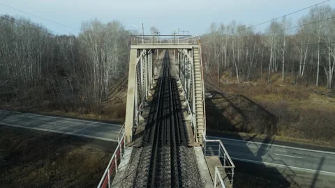 Aerial view(camera down) of the Railroad Bridge above Highway Cars Stock Footage 165475671