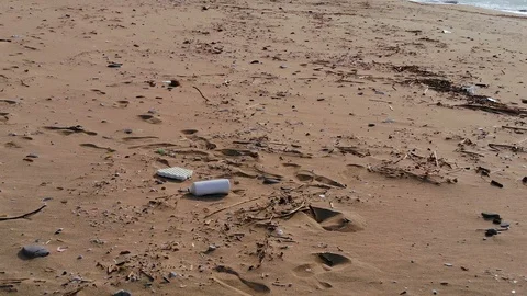 Aerial view,fly above Plastic pollution on sea coast after a storm, planet save Stock Footage 120921702