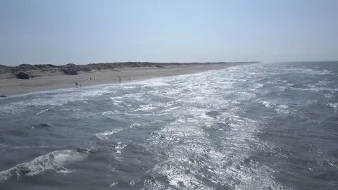 Aerial viewing old German bunkers and wavy North Sea shore Stock Footage 87254147