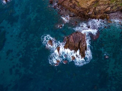 Aerial views with 4k drone, centinal direction of rocks and sea. Stock Photos