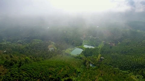 Aerial views above the clouds and farm Stock Footage 80349054