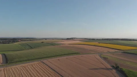 Aerial views of the fields and road with passing cars Stock Footage 201385761