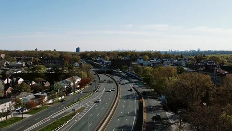 Aerial views flight oewr multiple lane highway leading towards New York City Stock-Footage 129852680
