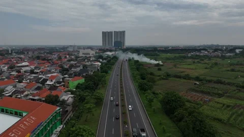 Aerial Views of Gresik City from Kebomas Toll Road Stock Footage 313106592