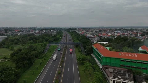 Aerial Views of Gresik City from Kebomas Toll Road (2) Stock Footage 313106636