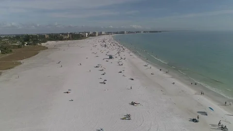 Aerial views of Siesta Beach near Sarasota Florida in February Stock Footage