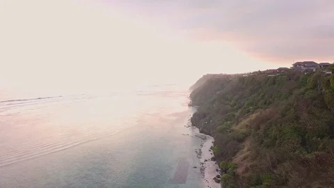 Aerial views of sunset along cliffs in Bali Stock Footage 80842289