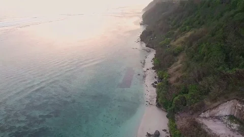 Aerial views of sunset along cliffs in Bali Stock Footage 80842844