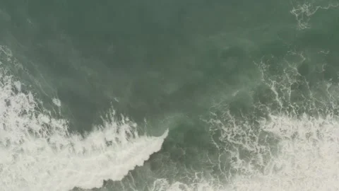 Aerial Views of Surging Waves on Overcast Days Stock Footage 243106827