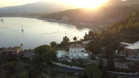 Aerial Villa by the sea at sunset. Taormina Italy Stock Footage
