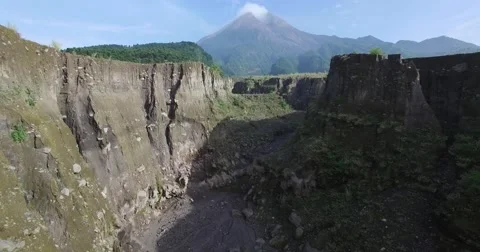 Aerial volcano chasm fly-through Mount Merapi (Gunung Merapi) Stock Footage 65551767