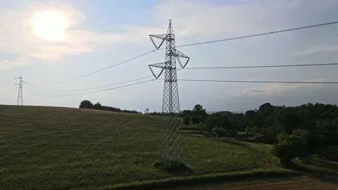 Aerial Voltage Tower with Power Lines Stock Footage 134280941
