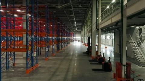 Aerial: Warehouse interior. Camera is moving forward. Stock Footage 77278167