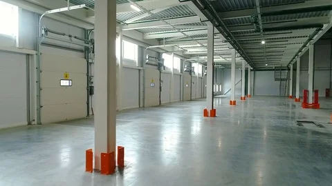 Aerial: Warehouse interior. Camera is moving forward. Stock Footage 77278175