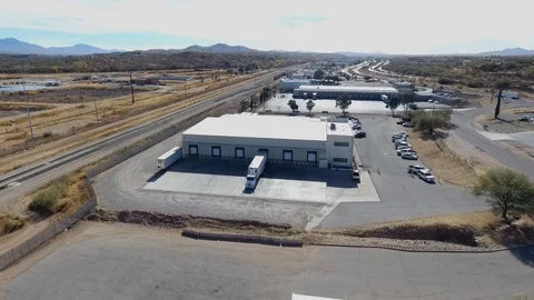 Aerial of warehouses in an industrial complex Stock Footage 70564834