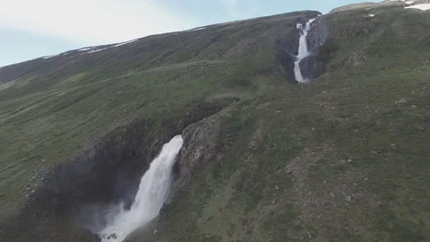 Aerial of water falling through a mountain Stock Footage 69740959