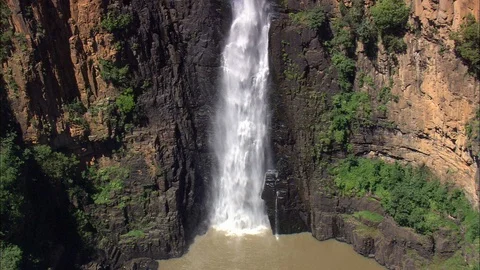 Aerial of waterfall falling down the hill into the river, Waterfall Stock Footage 109441014