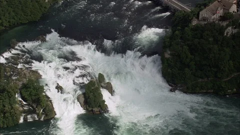 Aerial of waterfall gushing down the rock into the river, Rhine Waterfalls Stock Footage 108610022