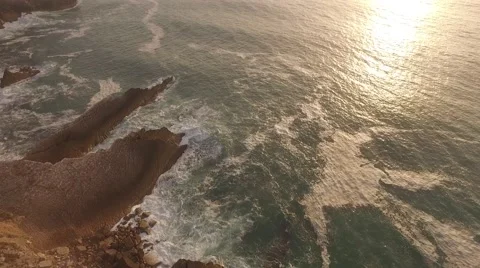 Aerial waves and rocks in sunset Stock Footage 67498039