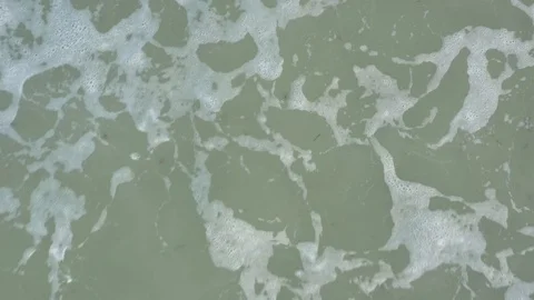 Aerial - Waves on a Beach - Closeup to Pull Back Shot at Sunset Vídeo Stock 103677275