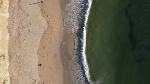 Aerial of waves on a beach Stock Footage 223852792