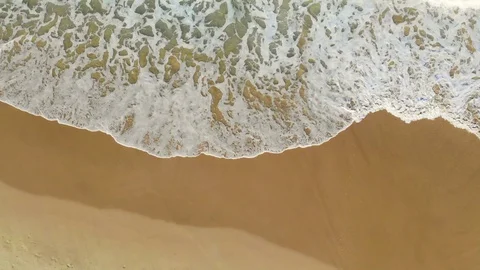 Aerial of Waves Breaking Onto Beach Stock Footage 123771904