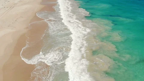Aerial of Waves Breaking onto Sand Video stock 116069238