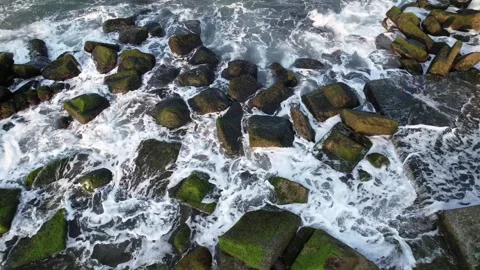 Aerial Waves Crash on Mossy Rocks Stock Footage 269494836