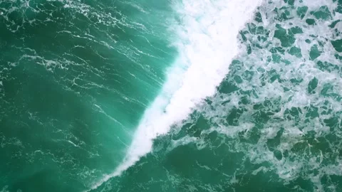 Aerial of waves crashing on a beach Stock Footage 310469397