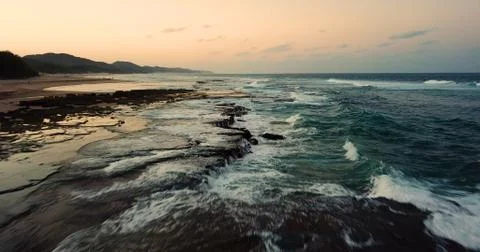 Aerial of waves crashing on reef Stock Photos