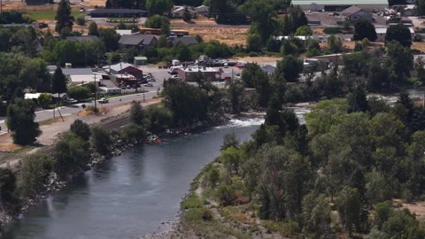 Aerial of Wenatchee River flowing through Cashmere Washington in summer Видео 340488158