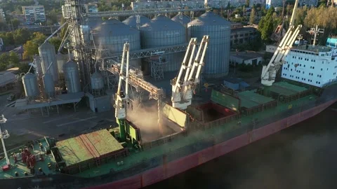 Aerial of wheat loading to bulker ship cargo hold at sea grain elevator in sea Video stock 201150103